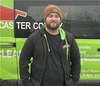 frank standing in front of servpro van