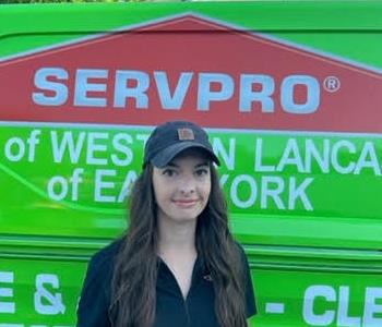 Brenna Elliott in front of SERVPRO van