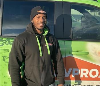 Mark standing in front of servpro van