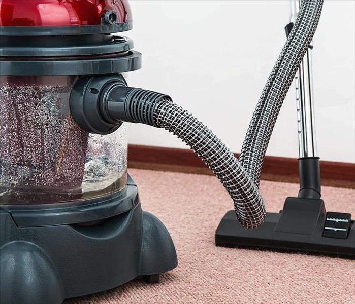 vacuum sucking up water